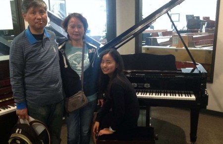 Karen Yuan's family with their new Perzina Grand Piano (Magic Lid installed)