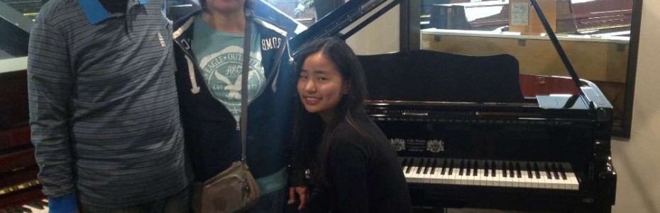 Karen Yuan's family with their new Perzina Grand Piano (Magic Lid installed)