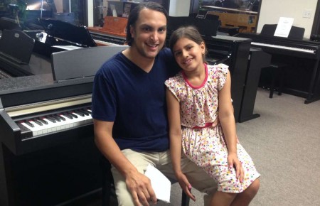 Fahim and his daughter with their Kurzweil Digital Piano
