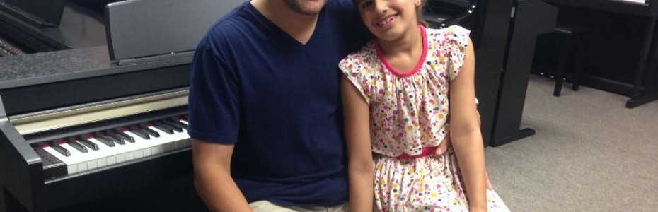 Fahim and his daughter with their Kurzweil Digital Piano