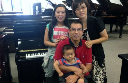 The Zhong Family with their new Hallet Davis piano.