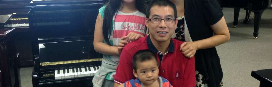 The Zhong Family with their new Hallet Davis piano.