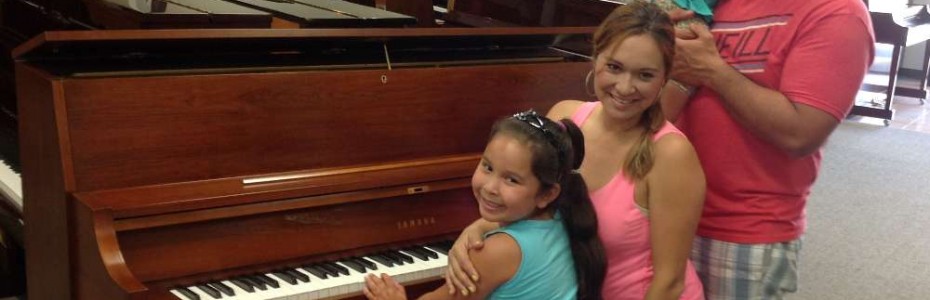Robert, Lily and Family and their Yamaha Studio Piano.