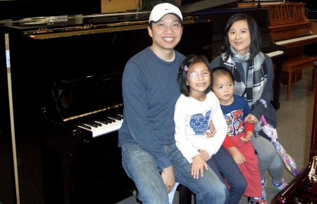 The Vu Family and their Yamaha Studio Piano