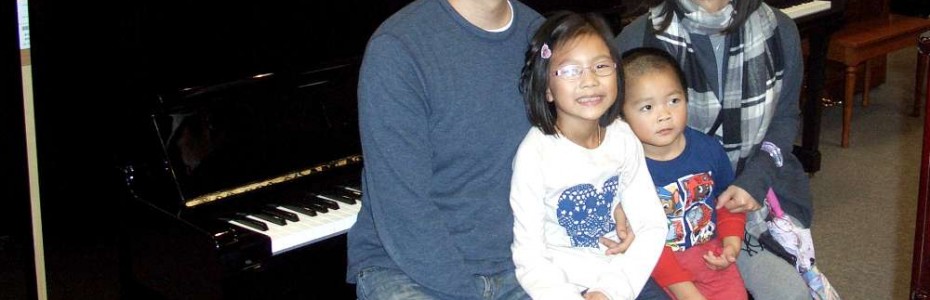 The Vu Family and their Yamaha Studio Piano