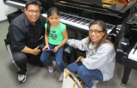 The Baez family and their new Starr Baby Grand