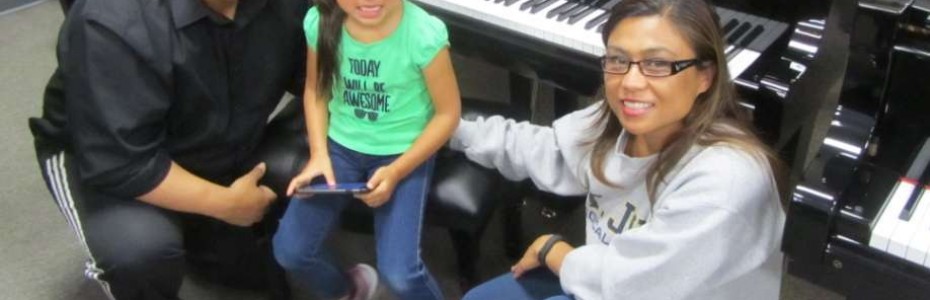 The Baez family and their new Starr Baby Grand