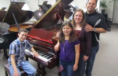 The Principato Family and their new Perzina Queen Anne Grand Piano.