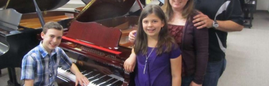 The Principato Family and their new Perzina Queen Anne Grand Piano.