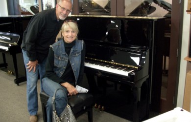 The Becketts with their new Kingsburg Piano