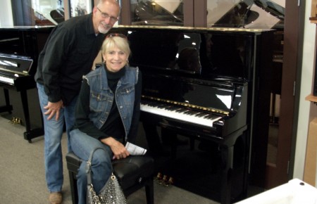 The Becketts with their new Kingsburg Piano