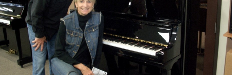 The Becketts with their new Kingsburg Piano